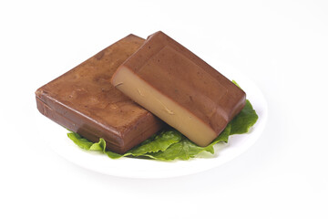 Sichuan Style Dried Bean Curd Tofu Blocks on Lettuce Leaves - Healthy Chinese Food Ingredient