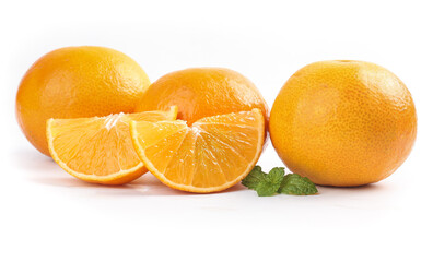 Fresh Oranges Whole and Sliced with Mint on White Background