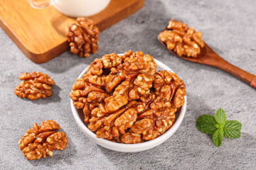 Fresh Walnuts in Bowl with Wooden Spoon - Premium Nuts Kernels for Healthy Snacking