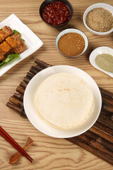 Asian Cooking Ingredients with Grilled Meat and Spices on Wooden Table