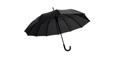 Black umbrella with water droplets on fabric against a dark background