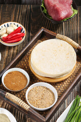 Fresh Tortillas with Raw Meat and Spices Ready for Cooking