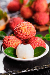 Zengcheng Lychee Immortal Queen Tree Fruits - Fresh Tropical Asian Delicacy on Plate with Leaves