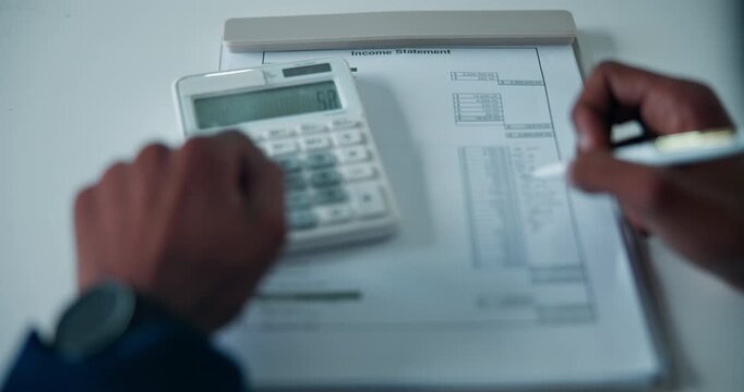 Hands, accounting and calculator in office with writing, paperwork and income statement at company. Person, money and notes with report, checklist and review with admin for tax compliance at agency