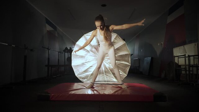 Young woman practicing and failing doing hola hoop. Slow motion