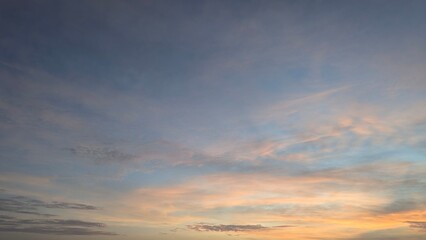 A stunning dawn sky with a beautiful gradient of deep blues and purples transitioning into soft...