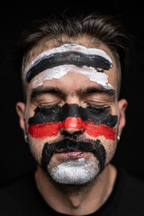 Man with Tribal Face Paint in Black Red White
