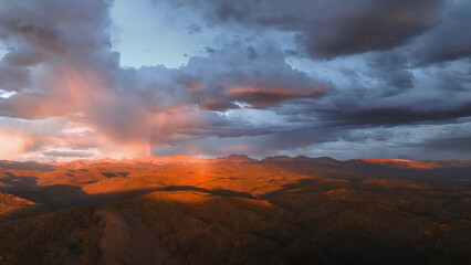 Beautiful drone sunset storm view over mountains at in Colorado fall