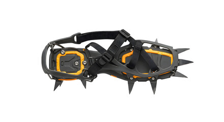 Black and orange crampons sit on black, showcasing design and materials. Use for extreme sports promotion, gear reviews, or retail displays.