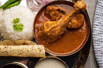 Chicken Kohlapuri is spicy Maharashtrian delicary of tender boneless chicken cooked with aromatic roasted ground spices and coconut. India food.