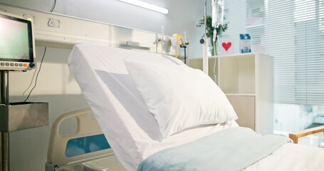 Hospital, healthcare and empty bed for medical recovery, healing and ecg machine with screen. Clinic interior, pillow and room with equipment, heart rate monitor and IV drip for wellness in icu