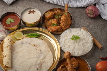 Kolhapuri chicken Thali is a popular Indian asian food platter consists of poultry meat, chikan...