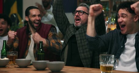 Victory, watching and people in bar with drink, goal and celebration in soccer tournament. Cheering, sport and football fans in pub with beer, score lead and joint excitement at viewing party.