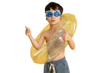 Asian kid A Young Boy Ready for Swim: A cheerful young boy is ready for a fun swim day, posing with a swim ring and swim goggles on PNG