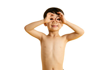 Fototapeta premium Asian A joyful young boy making binoculars with his hands, smiling and looking at the camera. He is showing his playful attitude and curiousity on PNG