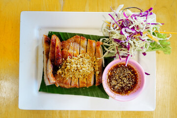 Roasted chicken with fried garlic and salad, Thai food