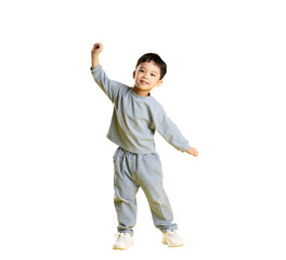 A happy asian toddler playing in the studio. The little kid is wearing a gray outfit, smiles, with one arm raised on PNG