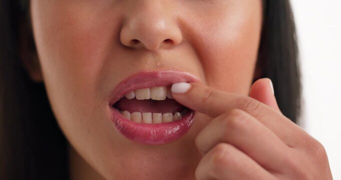 Mouth, woman and check teeth in studio for dental hygiene, whitening and veneers results. Hands, person and oral health of fresh breath, braces transformation and grooming routine on white background