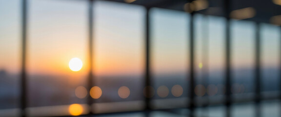 Blurred view of sunrise through large windows with grid pattern, capturing warm golden light streaming in and creating a peaceful abstract morning ambiance.