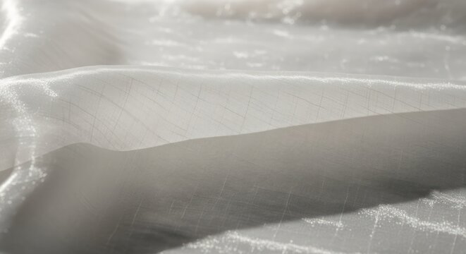 Elegant folds of sheer white fabric with subtle linear texture