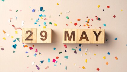 Wooden Blocks with Date 29 May. Calendar for birthday or anniversary on solid colored background with confetti