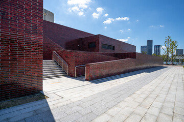 empty brick floor with modern building