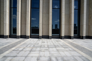 empty brick floor with modern building