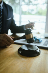 A male lawyer with gavel symbolizes justice, judgement, and legal authority, addressing courtroom trials, car accidents, insurance claims, and responsibility.