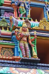 Fototapeta premium Female Guardian deities statue in Hindu temple tower 