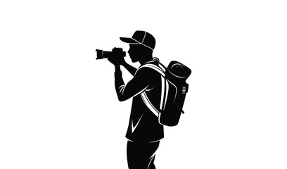 Silhouette of a photographer with a backpack taking a photo