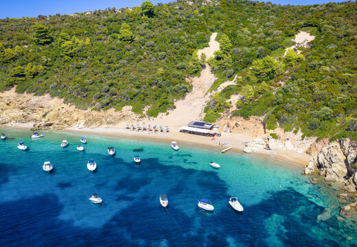 Aerial view of the popular Arkos Beach, on a small island next to the town of Skiathos, Sporades, Greece