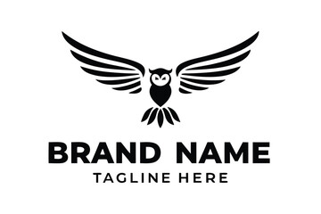 Obraz premium of a Stylized Owl with Outstretched Wings on a Branch Silhouette