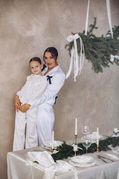 A family of mother and daughter gathered together at home for Christmas, beautiful and happy