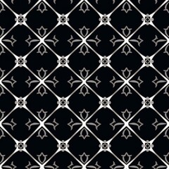 Fototapeta premium A luxury black and white seamless pattern featuring intricate symmetrical decorative shapes,