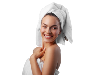 Smiling young woman applying facial cream under her eyes, wrapped in a white towel with a towel turban on her head. PNG with transparency	
