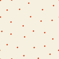 Hand drawn small red polka dotson light background.