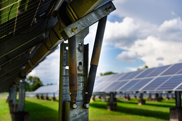 Heavy-duty galvanized steel mounting structure with hydraulic support rods for solar panels, providing stable ground installation and durability in large-scale solar power systems.