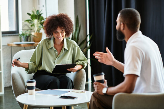 Young professionals engaged in a productive job interview at a modern office space - Powered by Adobe