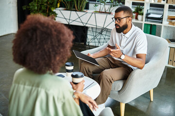 Dynamic job interview between a young professional man and woman in a modern office setting