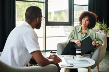 Job candidates discuss opportunities in a modern office setting during an important interview