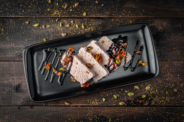 Pistachio semifreddo dessert served on a plate. Italian frozen treat with creamy texture, nutty flavor, and elegant gourmet style.