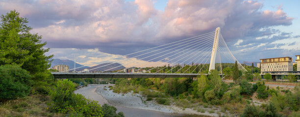Marvel at the stunning Millennium bridge spanning the Moraca river in scenic Podgorica
