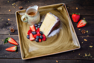 San Sebastian cheesecake with caramelized top served on a rustic background. Creamy texture, golden crust, and rich flavor make it a gourmet dessert.