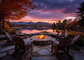 autumn sunset over lake with fire pit and chairs