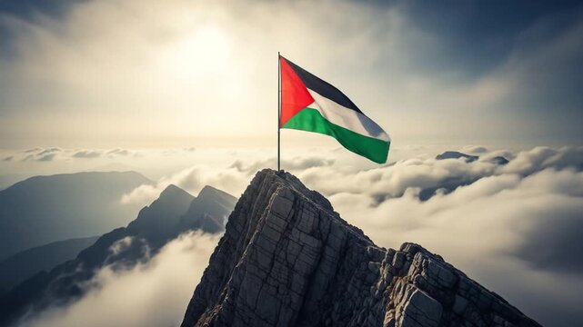 Palestine flag waving on the mountain peak against the backdrop of cloudy sky