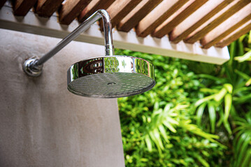Freshwater bath with circular shower in the garden