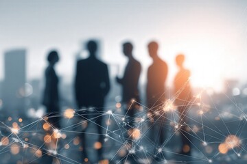 Blurred silhouettes of business people standing against a city skyline with glowing network connections overlay, representing teamwork and global connectivity