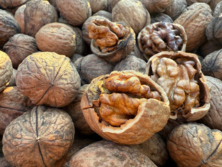 Walnuts edible seeds heap close up.