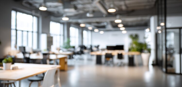 Bright and spacious office space in an unfocused view. Modern blurred background photo for banner, poster or magazine and website background. High quality