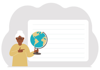 A woman holds a globe in his hand and points his finger at it. The concept of education, teacher, world conquest, ecology.